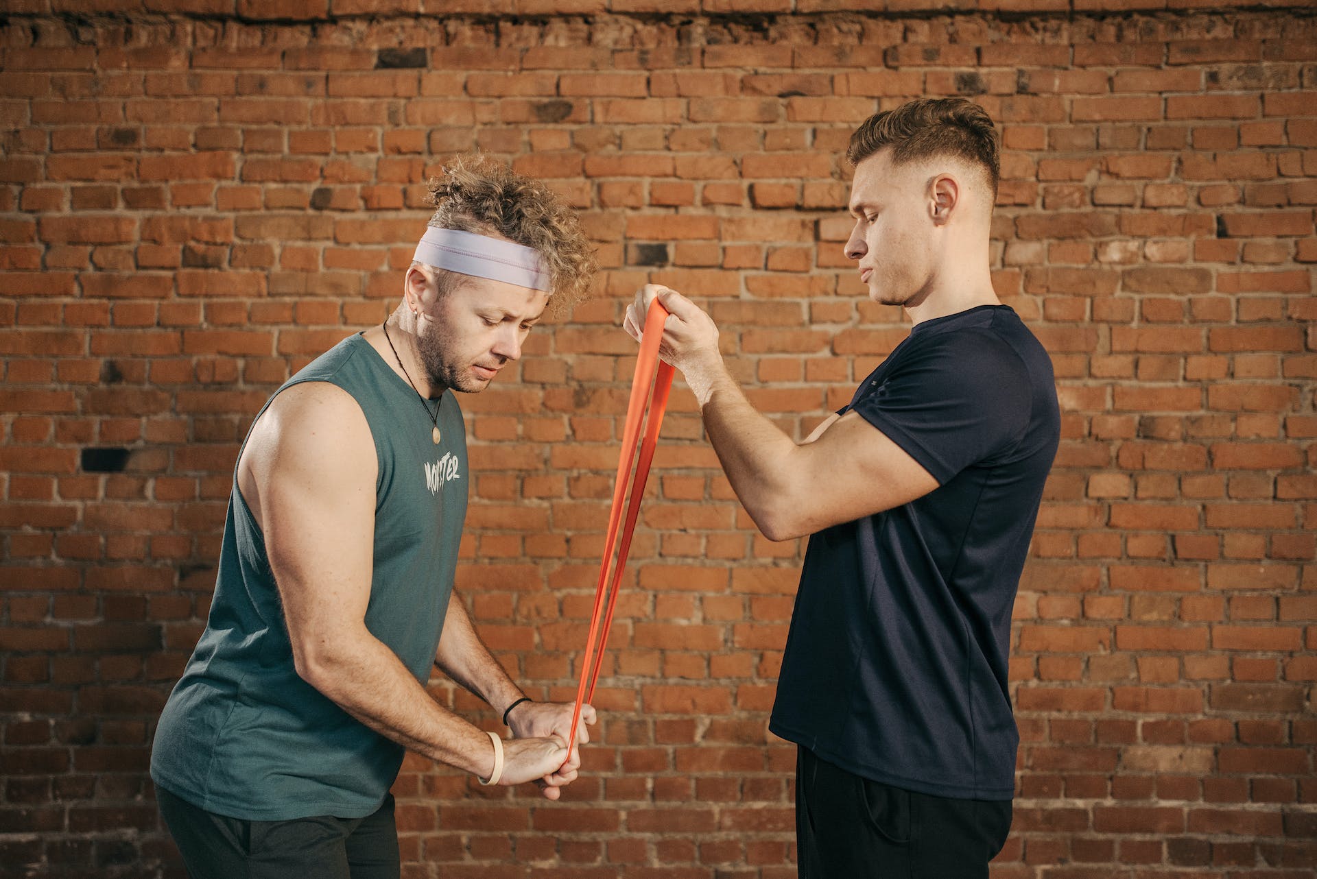 Personal trainer guides client through push exercise