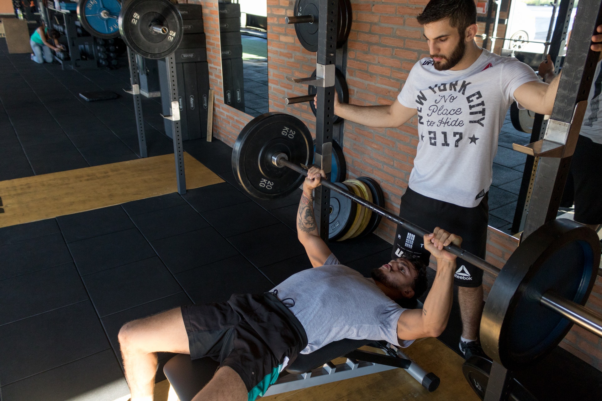 Couple participate in weight training at the gym