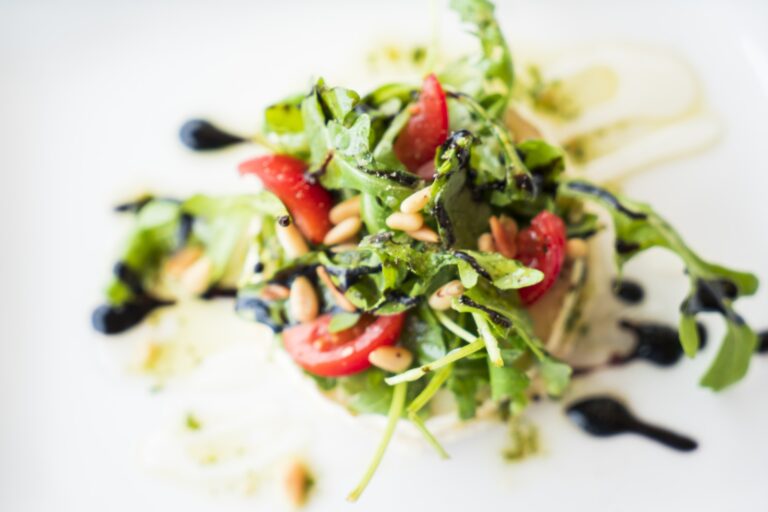 Healthy garden salad topped in nuts